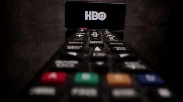 HBO Pay TV - Flight over TV Remote control - CITY OF FRANKFURT, GERMANY - MARCH 29, 2021 — Stock Video