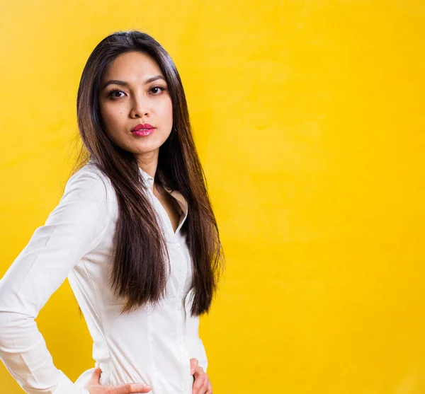 Young self-confident woman in a studio