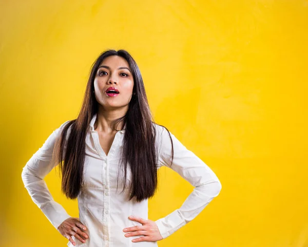 Young self-confident woman in a studio