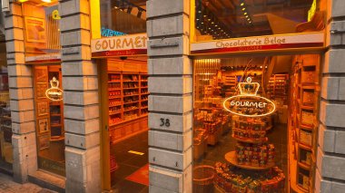 BRÜKSEL, BELGIUM - 26 Kasım 2025 - Aydınlatılmış Brüksel çikolata dükkanı vitrininde Chocolaterie Belge Gurme 'de neon bir tabelayla
