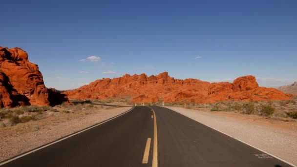 Long and empty road through the Valley of Fire National Park . — Stock Video