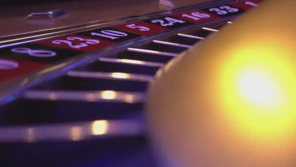 Macro view on a Roulette Wheel in a casino - ball falls in field 8 black — Stock Video