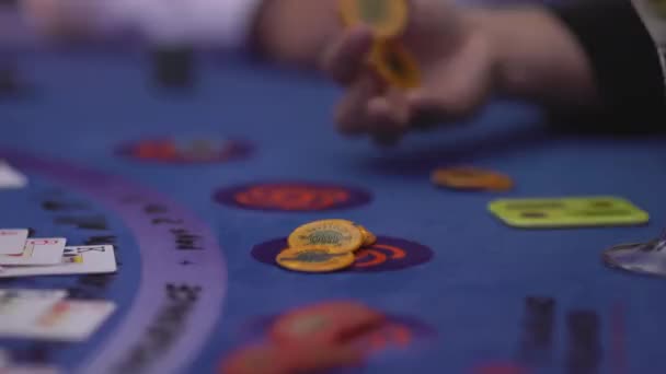 Gambler playing with chips at a Back Jack table — Stock Video