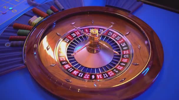 Roulette wheel - groupier spins the wheel - ball lands on field 2 black — Stock Video