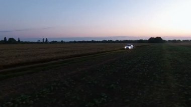 white car speeding in the field, aero