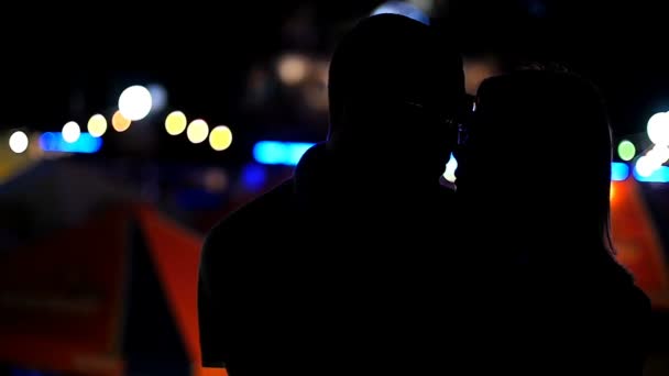 Lovers kissing on the background of night lights — Stock Video