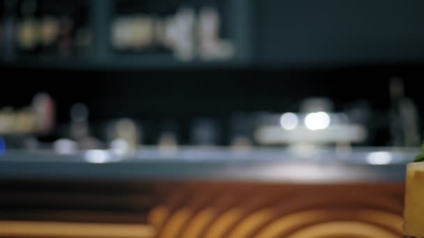 Close up of two people are cheering with cocktails in the bar, restaurant or disco club. — Stock Video