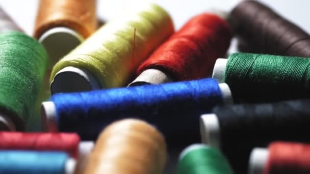 Sewing tools. Sewing threads. close-up. rotation. spools of thread of different colors . Hobbies, handicrafts. Hand made — Stock Video