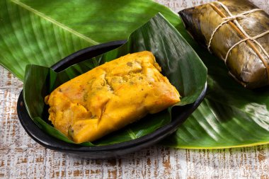 Tamale Typical Colombian Food Wrapped In Banana Leaves clipart