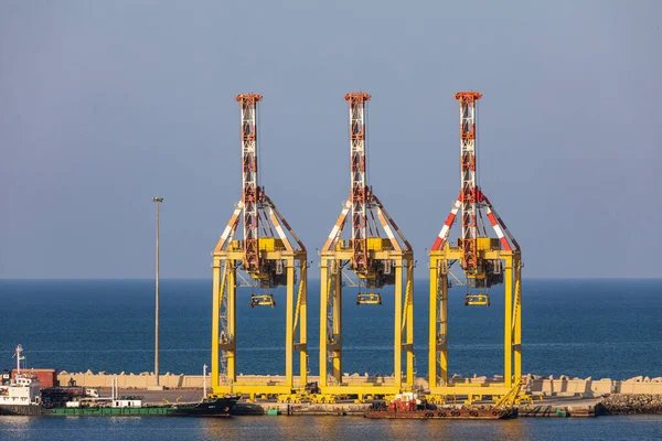 Middle East, Arabian Peninsula, Oman, Muscat, Muttrah. Container port cranes at Muttrah harbor.