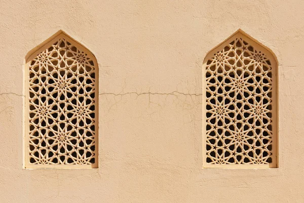 Middle East, Arabian Peninsula, Oman, Ad Dakhiliyah, Bahla. Windows with traditional decorative screens in Bahla, Oman.