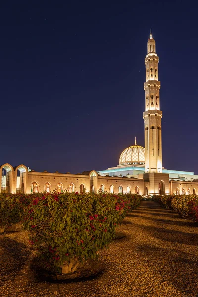 Middle East, Arabian Peninsula, Oman, Muscat. Night time view of the Sultan Qaboos Grand Mosque in Bawshar, Muscat.