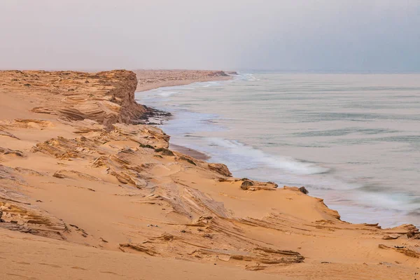 Middle East, Arabian Peninsula, Oman, Ash Sharqiyah North, Jaalan Bani Bu Ali. Surf on the coast of the Arabian Sea in Oman.