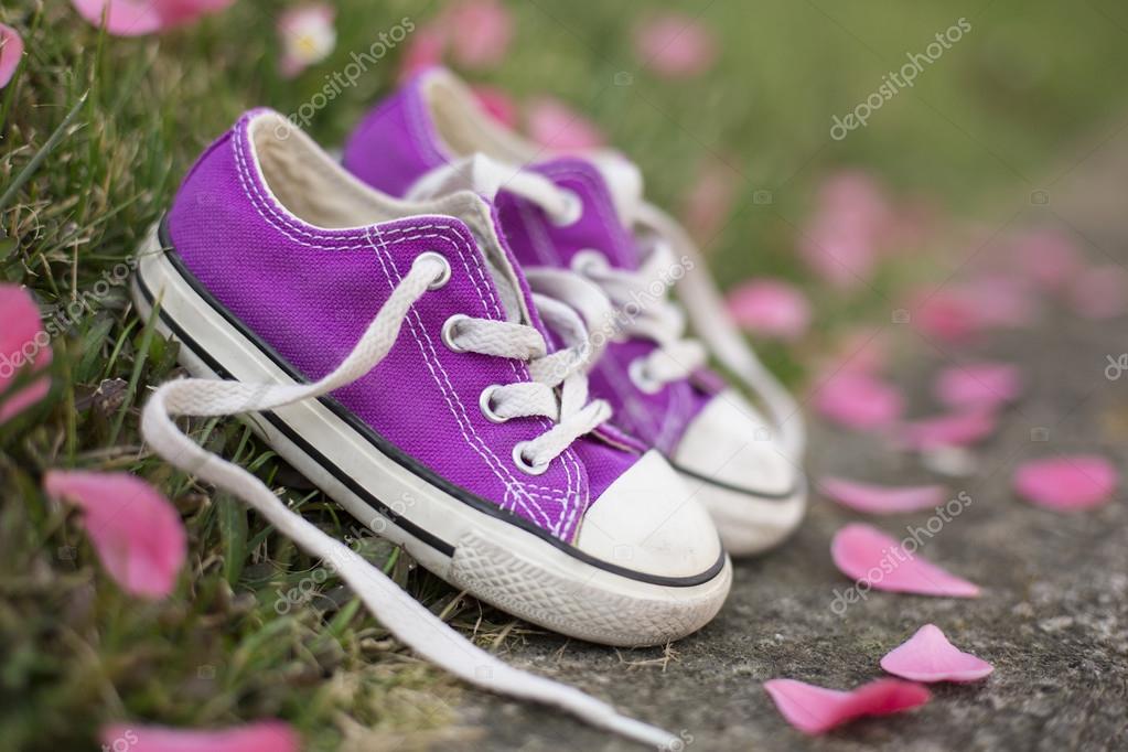 Little girl sneakers shoes — Stock Photo © ERphotographer 104854942