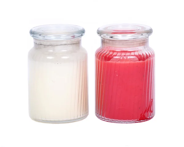 Velas blancas y rojas en el frasco de la casa más caliente — Foto de Stock