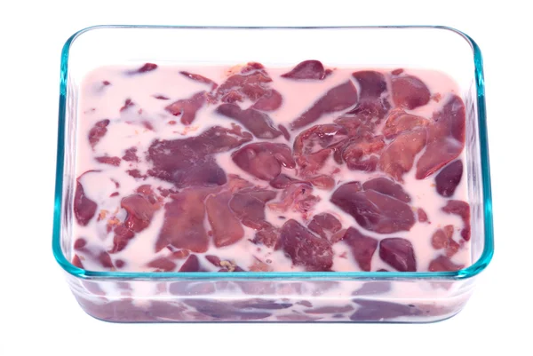 Organic chicken liver in milk and glass container — Stock Photo, Image