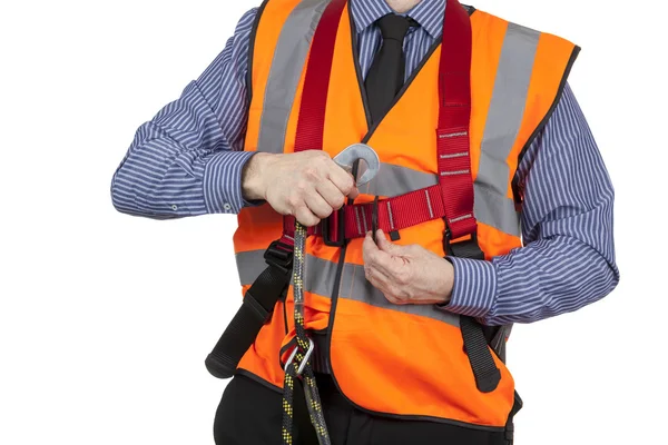 Building Surveyor in orange visibility vest attaching lanyard — Stock Photo, Image