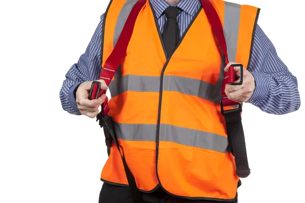 Building Surveyor in orange visibility vest putting on a harness — Stock Photo, Image