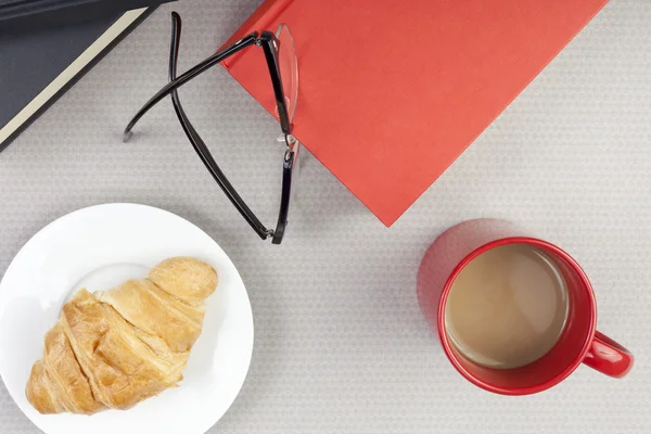 Table top of a reader taking a coffee break Royalty Free Stock Photos