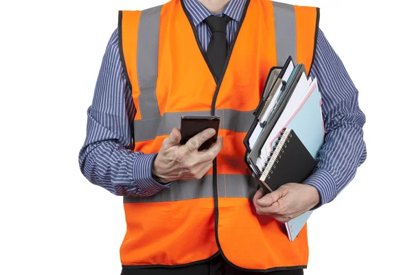Building Surveyor in orange visibility vest carrying folders — Stock Photo, Image