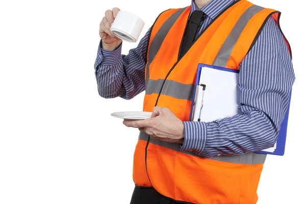 Building Surveyor in orange visibility vest having a tea break — Stock Photo, Image