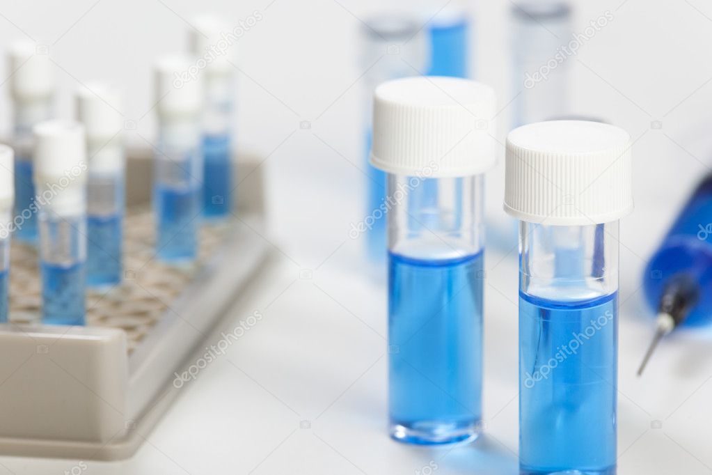 Close up of a vial containing a blue fluid