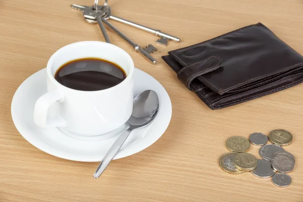 Cup of coffee on table with a wallet and cash — Stock Photo, Image