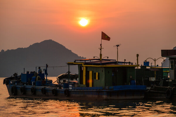Asian fishing boats at sunset