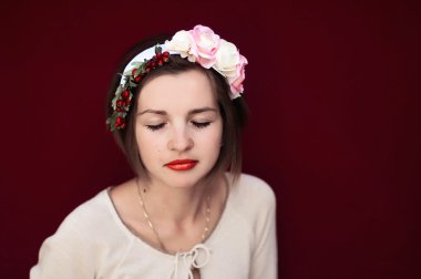 Wreath on girl head. Young beautiful woman portrait with long ha