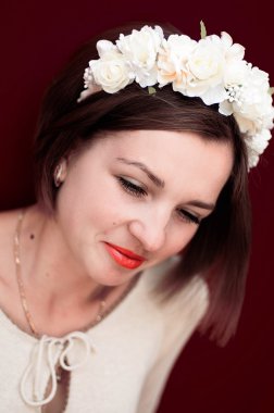Wreath on girl head. Young beautiful woman portrait with long ha