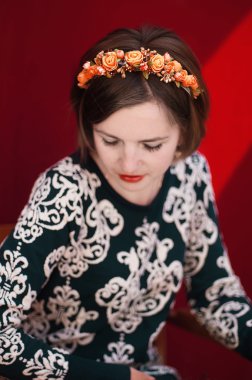 Wreath on girl head. Young beautiful woman portrait with long ha