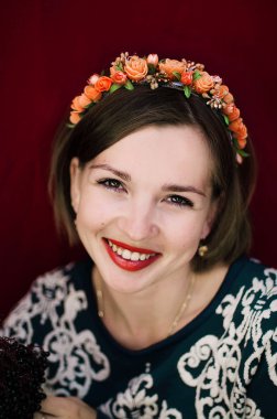 Wreath on girl head. Young beautiful woman portrait with long ha