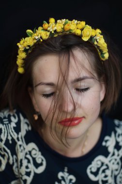 Wreath on girl head. Young beautiful woman portrait with long ha