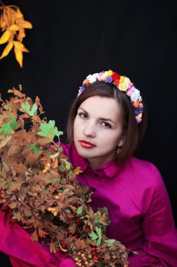 Wreath on girl head. Young beautiful woman portrait with long ha