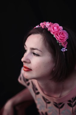 Wreath on girl head. Young beautiful woman portrait with long ha