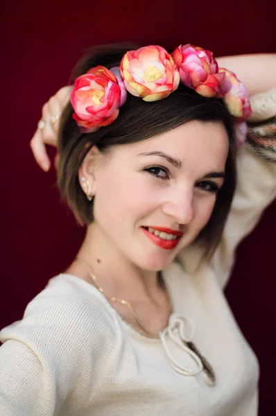 Wreath on girl head. Young beautiful woman portrait with long ha