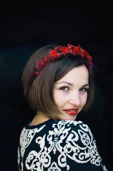 Wreath on girl head. Young beautiful woman portrait with long ha