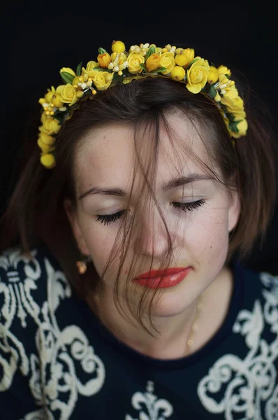 Wreath on girl head. Young beautiful woman portrait with long ha