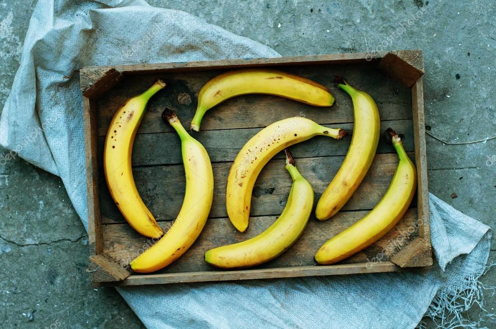 Sliced Banana Peel On White Plate And Wooden Background, Peeled