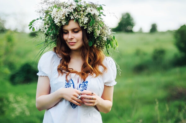 Young pagan Slavic girl conduct ceremony on Midsummer. Beauti gi