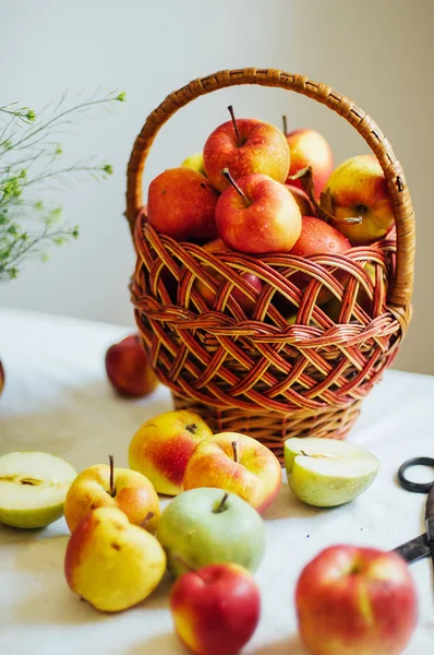 Apples  on white table. Sweet apples on table on bright backgrou