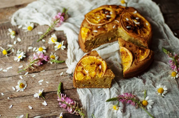 Delicious fresh homemade pie with orange zest, milk, butter, egg — Stock Photo, Image