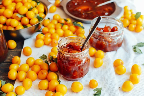 Plums jam in a small cup. Homemade spicy mirabelle, greengage pl — Stock Photo, Image