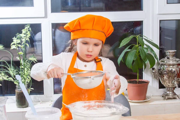 Little Cute Girl Orange Chef Costume Breaks Raw Egg Pours — Stok fotoğraf