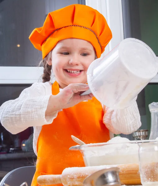 Little Cute Girl Orange Chef Costume Breaks Raw Egg Pours — Stock Photo, Image
