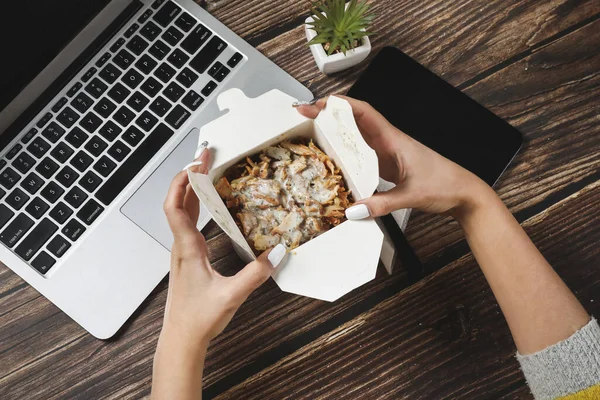 Woman Hands Opens Food Container Wooden Table Laptop Fast Food Stock Image