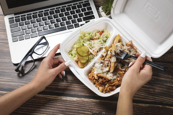 Woman Hands Opens Food Container Wooden Table Laptop Fast Food Stock Photo