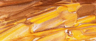 Parlak lekeli turuncu kahverengi arka plan. Soyut boya dokusu. Altın boyaların yaratıcı fırça darbeleri. Makyaj konsepti. Şenlikli arkaplan