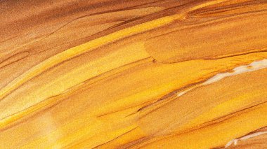 Soyut ışıldayan metalik doku. Bronz turuncu arka plan ve parlak lekeler. Altın ışıltılı fırça darbeleri. Şenlikli arkaplan