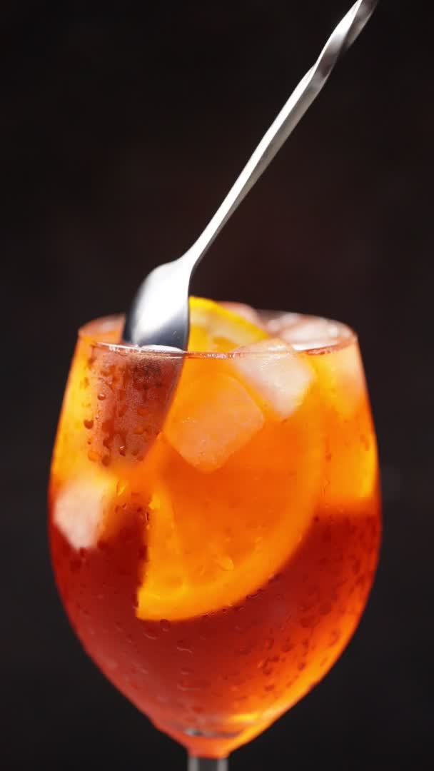Aperol Spritz Cocktail Black Background Spoon Mixes Beverage Glass Summer — Stock Video
